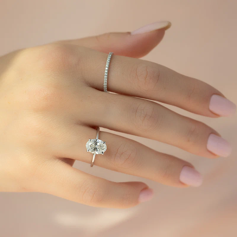 Oval diamond ring on hand showing carat size